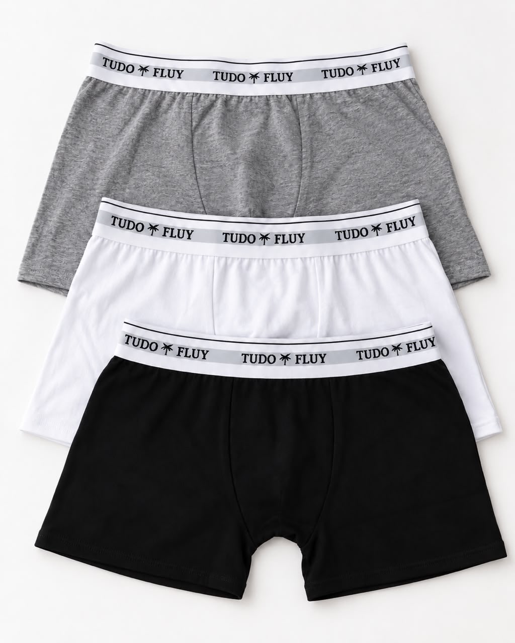 Três cuecas boxer Tudo Fluy nas cores cinza, branca e preta
